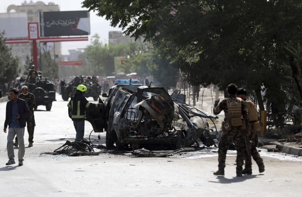 Separate bombs hit two minivans in a mostly Shiite neighborhood in the Afghan