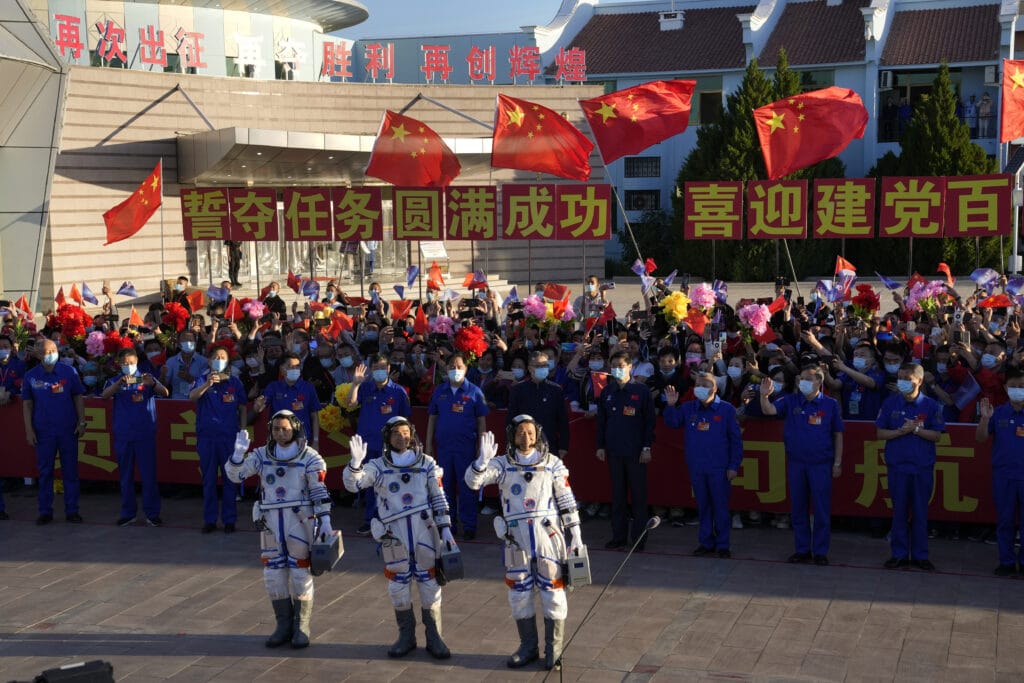 A Chinese spaceship carrying a three-person crew docked with China's new space station