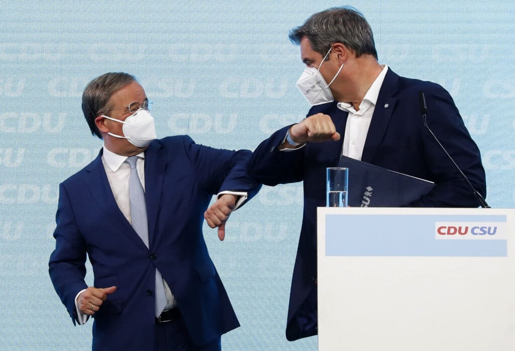 Germany’s center-right bloc is pledging to boost the economy without raising taxes