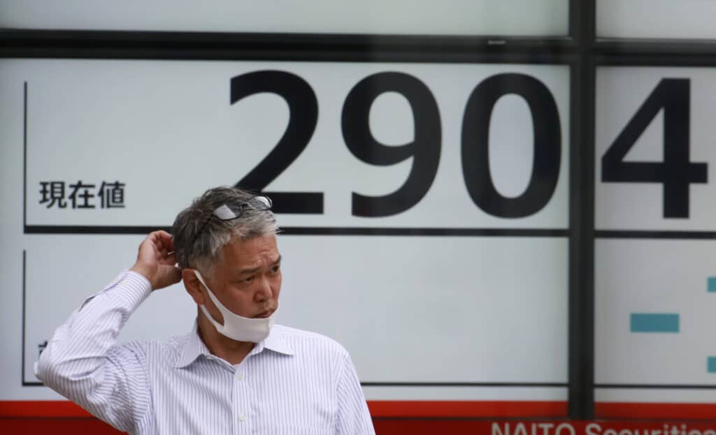 Global stock markets declined Monday after Wall Street hit a new high