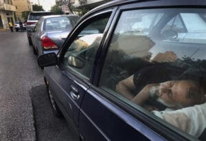 Ibrahim Arab waits in line several hours a day in the hot summer sun to buy gas