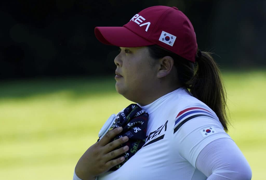 Inbee Park, of South Korea, refreshes with an ice pack on the 14th hole during the second round of the women's golf event at the 2020 Summer Olympics