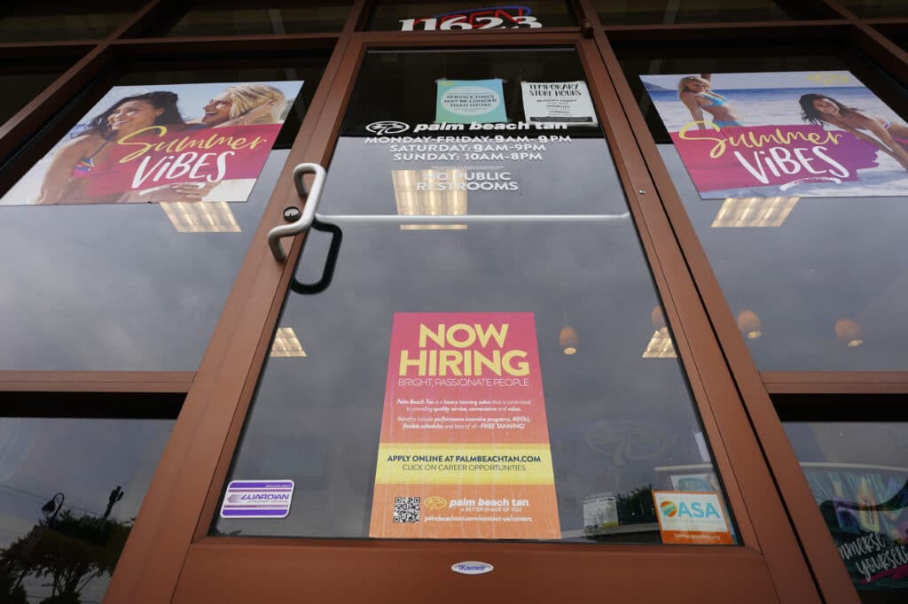 A Now Hiring sign at a business in Richmond, Va.,