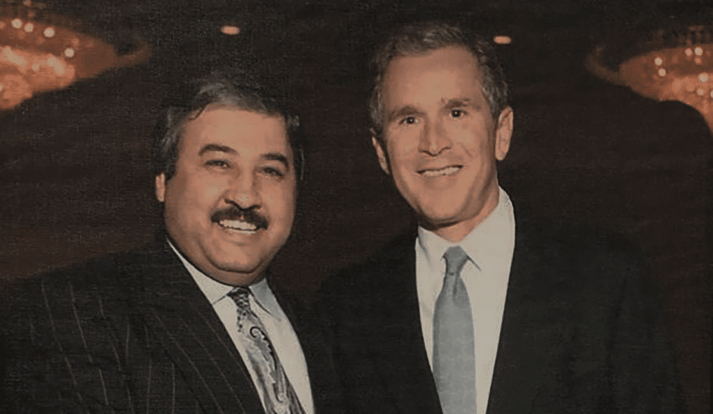 An old photo of Mr. Ahmed El-Yasin with former President George W. Bush