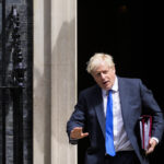 UK's Johnson battles to stay in job after top ministers quit