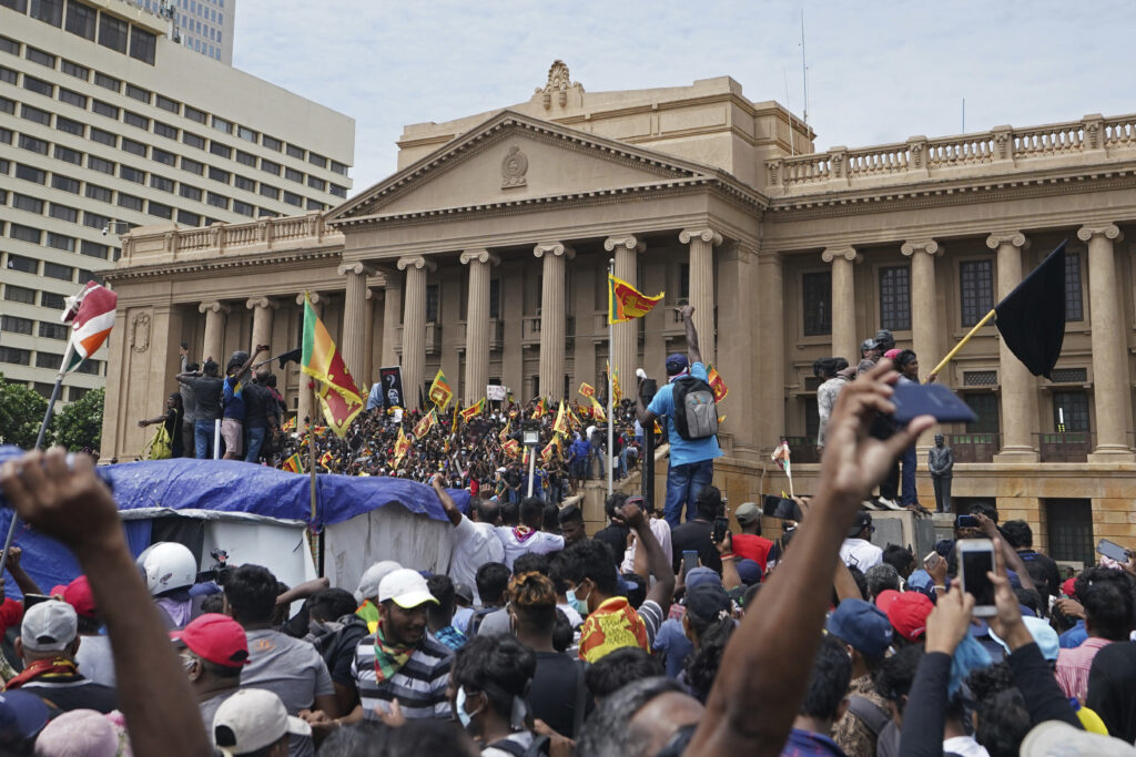 Sri Lankans storm president's house, office in biggest rally