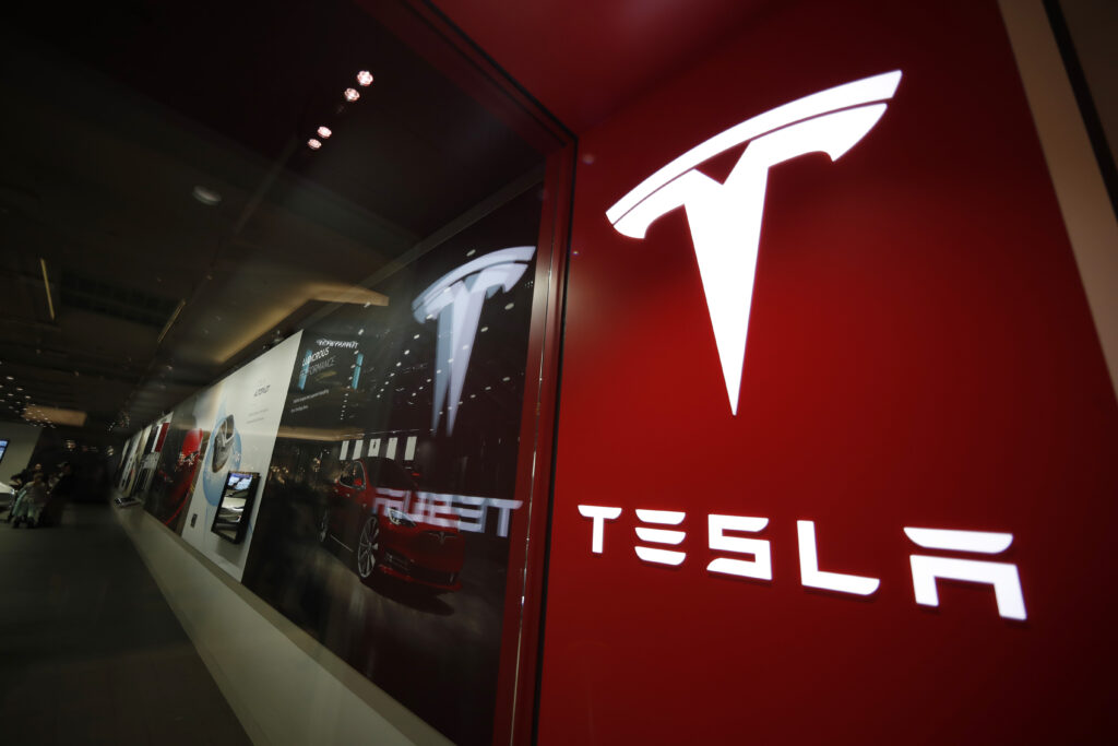 Tesla 2Q profit falls from 1Q, but is stronger than expected