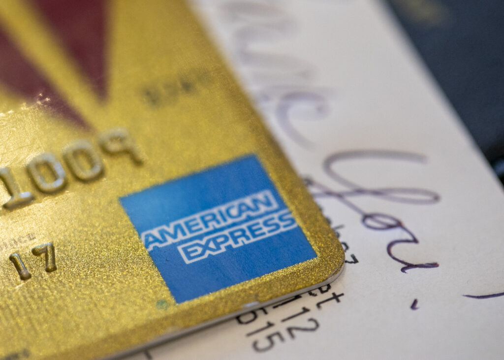 AmEx 2Q profits fall 14% despite higher cardmember spending