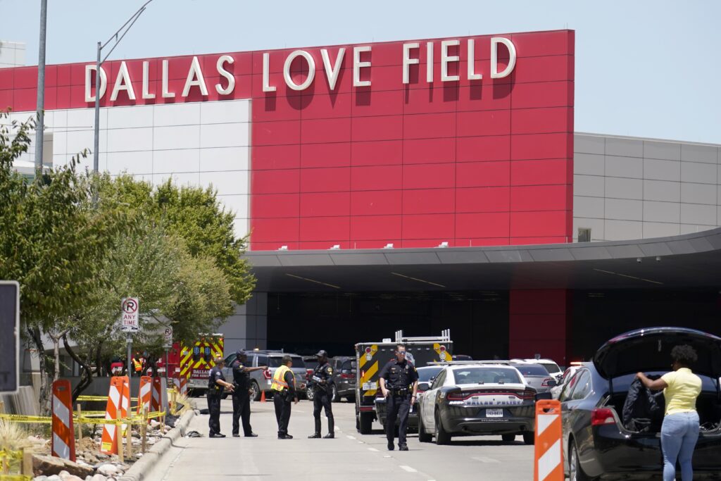 Police: Woman opened fire in Dallas airport; cop shot her