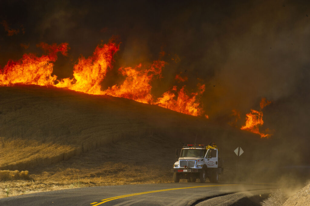 Wildfires in West explode in size amid hot, windy conditions
