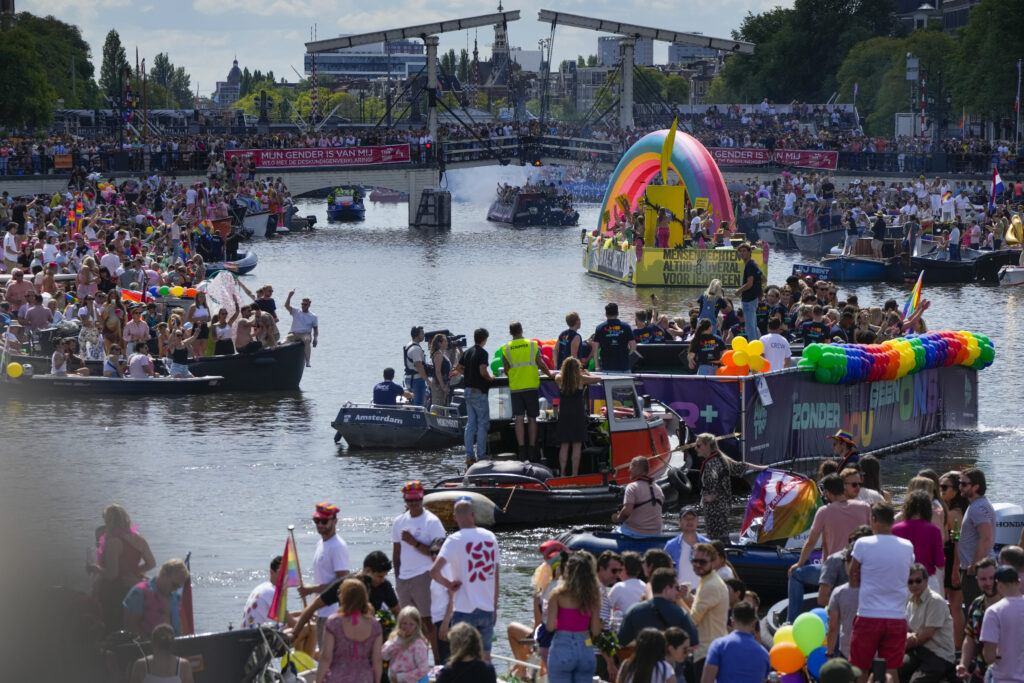 Huge crowds watch Amsterdam Pride's canal parade celebration