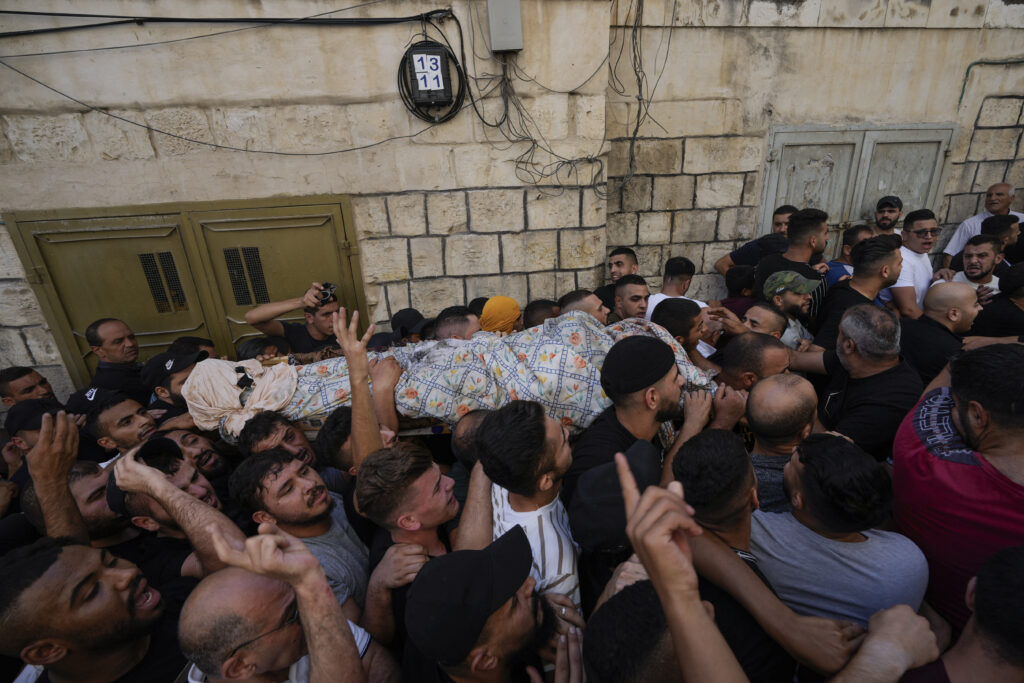 Palestinians say Israeli troops kill 3 in West Bank raid