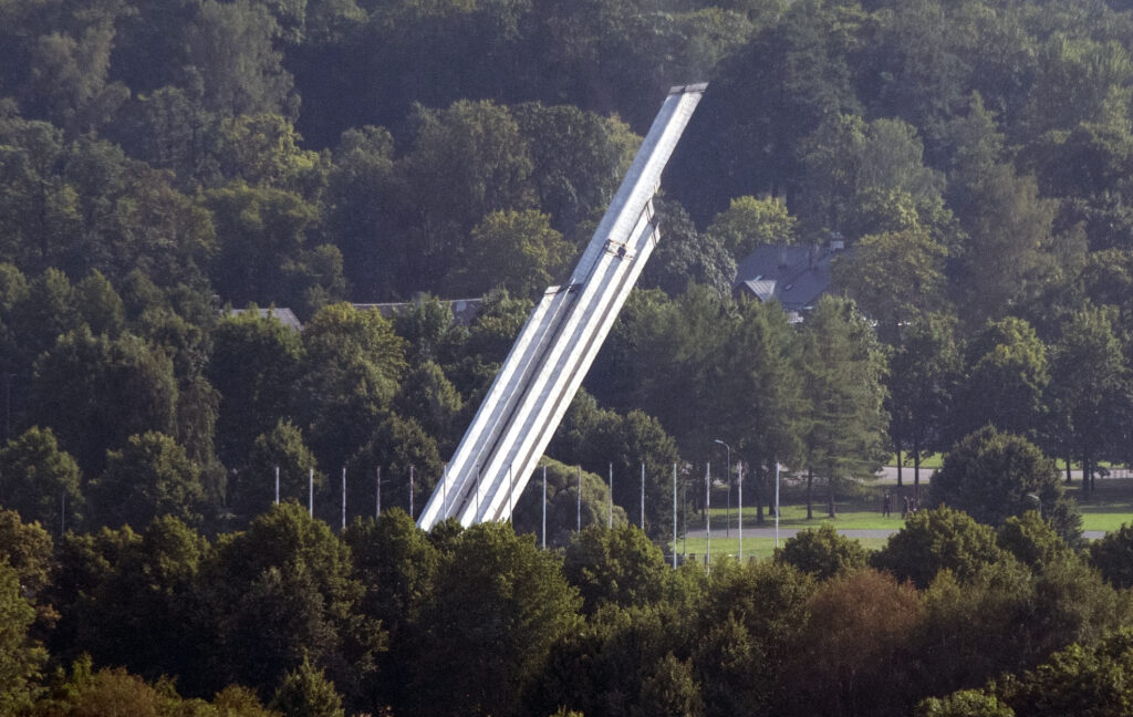 Latvia brings down Soviet-era monument's obelisk in capital