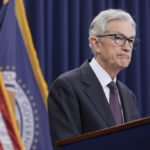 Federal Reserve Holds Rates, Sees Inflation Rising
