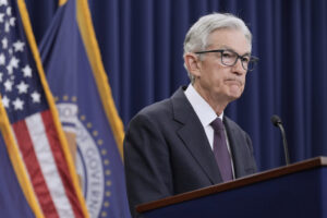 Federal Reserve Holds Rates, Sees Inflation Rising