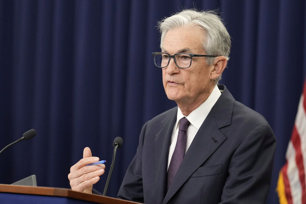 Federal Reserve Holds Rates, Sees Inflation Rising
